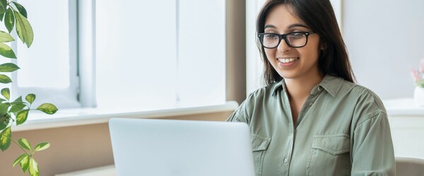 Woman smiling at computer